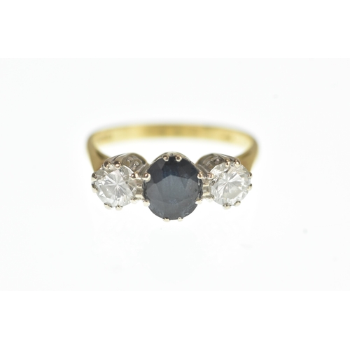 33 - A blue sapphire and diamond 18ct yellow a white gold engagement ring, with central oval cut blue sap... 