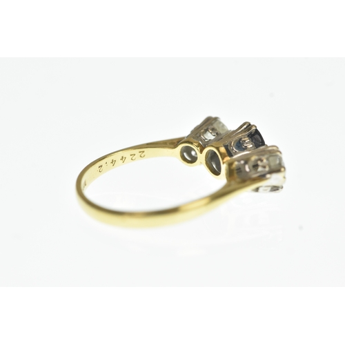 33 - A blue sapphire and diamond 18ct yellow a white gold engagement ring, with central oval cut blue sap... 
