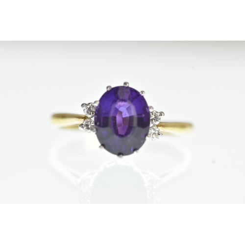 36 - A purple amethyst and diamond 18ct yellow and white gold dress ring, with central oval cut claw set ... 