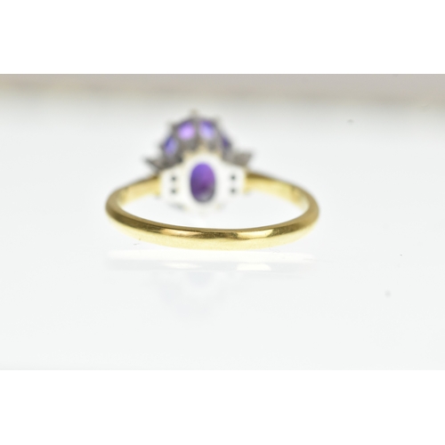 36 - A purple amethyst and diamond 18ct yellow and white gold dress ring, with central oval cut claw set ... 