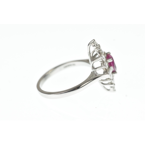 4 - A ruby and diamond and platinum cluster sunburst ring, set with a central oval-cut ruby surrounded b... 