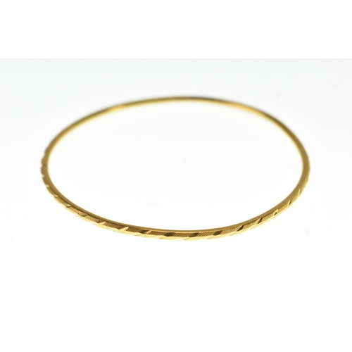 41 - A 22ct yellow gold bangle, of circular form and decorated with spiral twist decoration, 6.6cm diamet... 