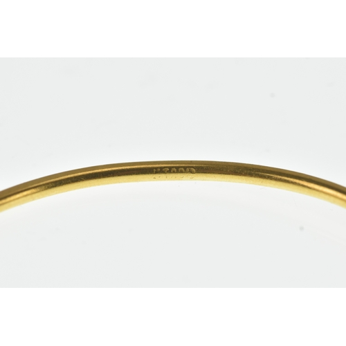 41 - A 22ct yellow gold bangle, of circular form and decorated with spiral twist decoration, 6.6cm diamet... 