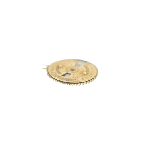 42 - A Victorian gold and silver perpetual calendar pendant/ fob, engraved 'perpetual calendar' and sun '... 
