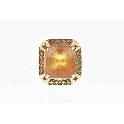 43 - A Citrine yellow gold dress ring, the square cut stone measuring 12mm x 13mm, in a four claw setting... 