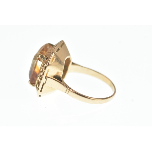 43 - A Citrine yellow gold dress ring, the square cut stone measuring 12mm x 13mm, in a four claw setting... 
