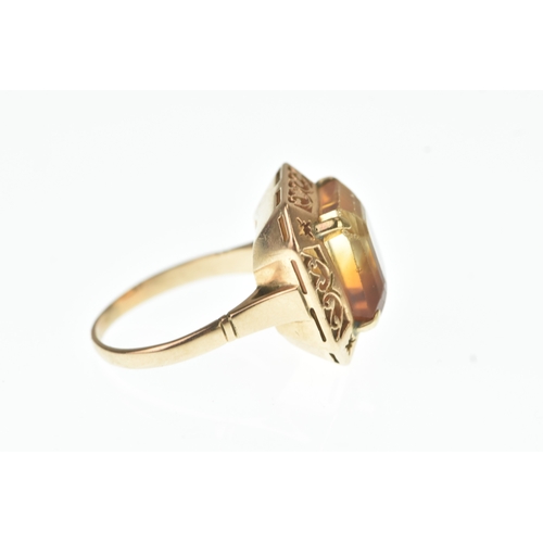 43 - A Citrine yellow gold dress ring, the square cut stone measuring 12mm x 13mm, in a four claw setting... 