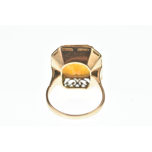 43 - A Citrine yellow gold dress ring, the square cut stone measuring 12mm x 13mm, in a four claw setting... 