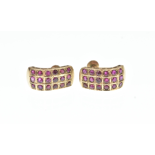 45 - A pair of ruby yellow gold earrings, unmarked, each of curved design set with rows of circular cut r... 