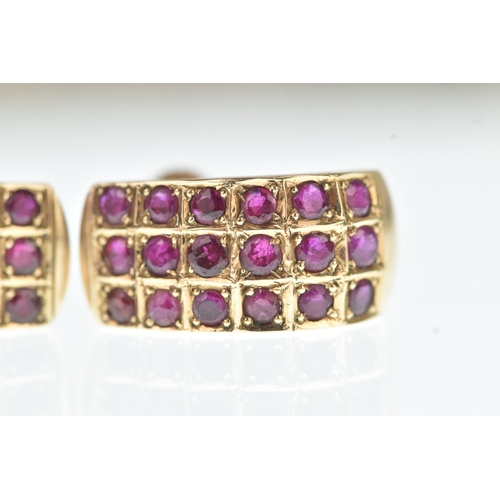 45 - A pair of ruby yellow gold earrings, unmarked, each of curved design set with rows of circular cut r... 