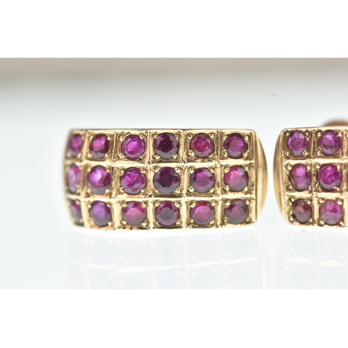 45 - A pair of ruby yellow gold earrings, unmarked, each of curved design set with rows of circular cut r... 