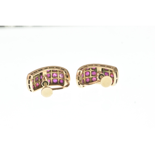 45 - A pair of ruby yellow gold earrings, unmarked, each of curved design set with rows of circular cut r... 