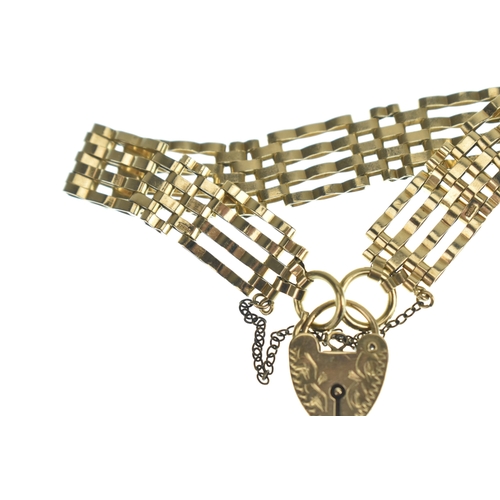 46 - A 9ct gold gatelink bracelet, having a heart padlock clasp and safety chain, stamped 375, 15.8 grams... 