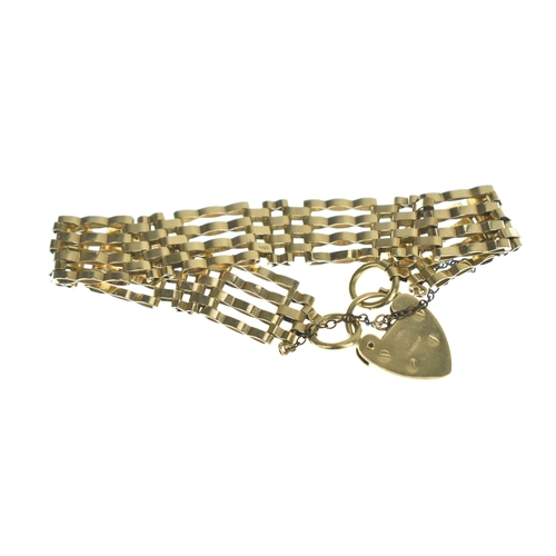 46 - A 9ct gold gatelink bracelet, having a heart padlock clasp and safety chain, stamped 375, 15.8 grams... 