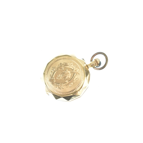 48 - An early 20th century 14ct gold ladies fob watch, having an engine turned case with a vacant shield ... 