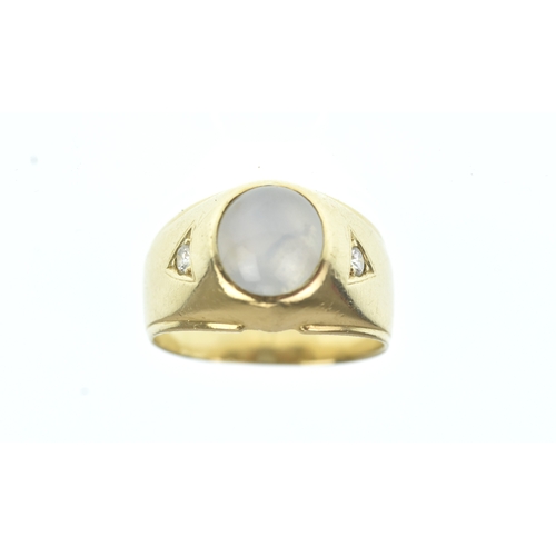 52 - A moonstone and diamond 14ct gold gents ring, the oval moonstone cabochon measuring 10.5mm x 9.5mm, ... 