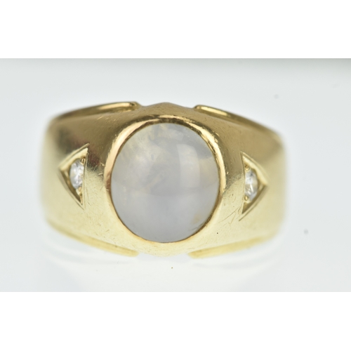 52 - A moonstone and diamond 14ct gold gents ring, the oval moonstone cabochon measuring 10.5mm x 9.5mm, ... 