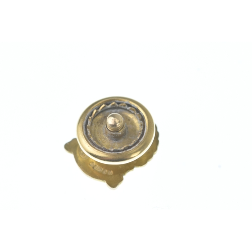 55 - A Shell 25 Year Service tie tack pin, in the form of a shell and inset with a single brilliant cut d... 