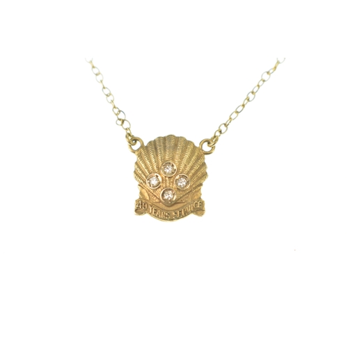 57 - A Shell 40 Year Service tie clip, suspending on chain links a shell inset with four brilliant cut di... 
