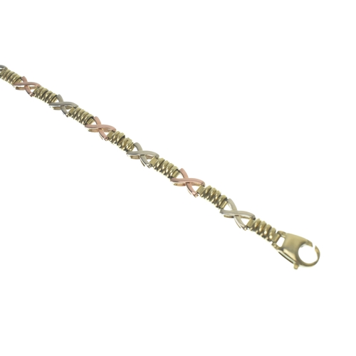 7 - A 9ct gold tri coloured hugs and kisses (XO) link bracelet, having a lobster claw clasp, stamped 375... 