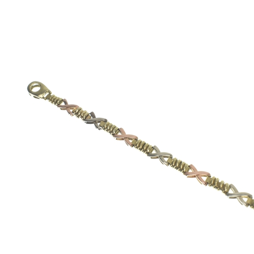 7 - A 9ct gold tri coloured hugs and kisses (XO) link bracelet, having a lobster claw clasp, stamped 375... 