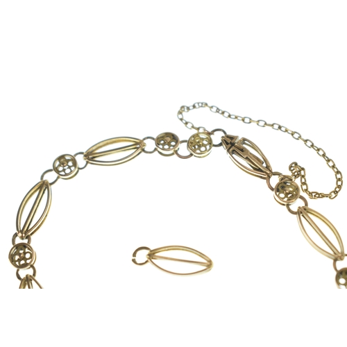 8 - A yellow gold bracelet, featuring marquise-shaped and round links with four leaf clover pierced deco... 
