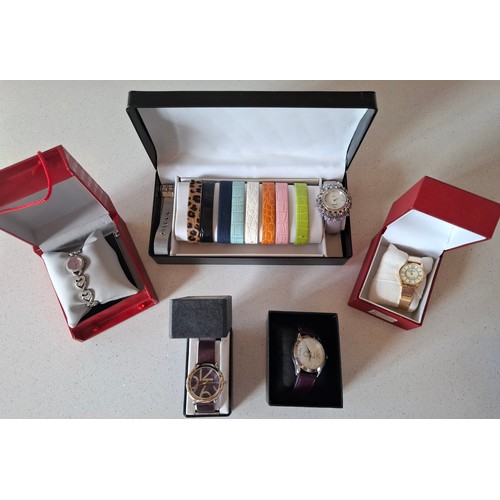 29 - Ladies boxed fashion watches to include a Gossip watch set with 10 interchangeable straps, a purple ... 