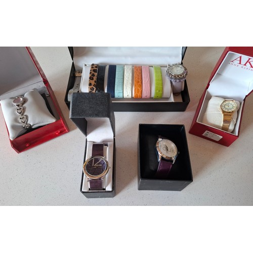 29 - Ladies boxed fashion watches to include a Gossip watch set with 10 interchangeable straps, a purple ... 