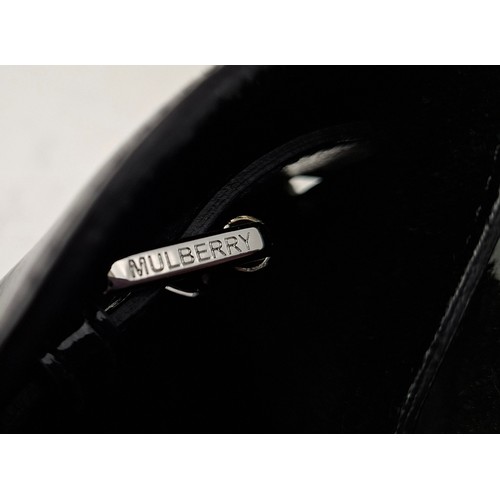 9 - Mulberry- A black patent leather 'Bayswater Heritage' handbag having silver tone hardware, internal ... 