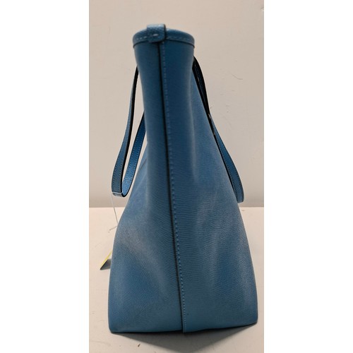 18 - Coach- An Azure blue crossgrain leather and coated canvas 'City Zip' tote bag having silver tone har... 