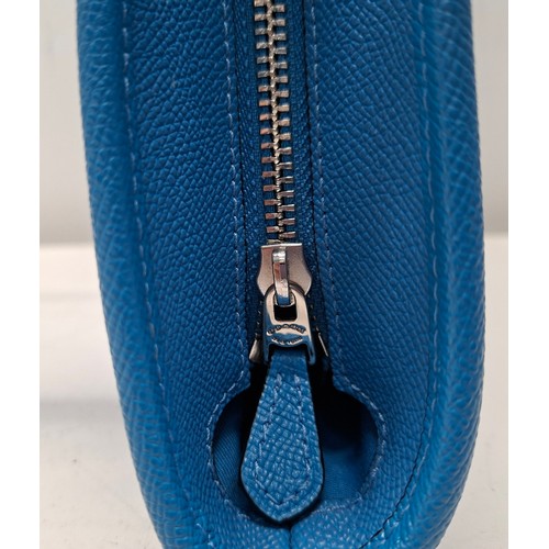 18 - Coach- An Azure blue crossgrain leather and coated canvas 'City Zip' tote bag having silver tone har... 
