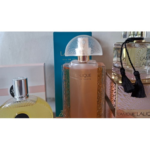 22 - Lalique- Three fragrances comprising 'L'Amour' together with a white metal Lalique necklace. Locatio... 