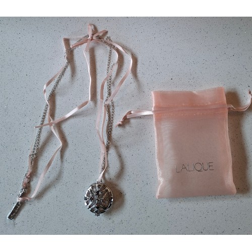22 - Lalique- Three fragrances comprising 'L'Amour' together with a white metal Lalique necklace. Locatio... 