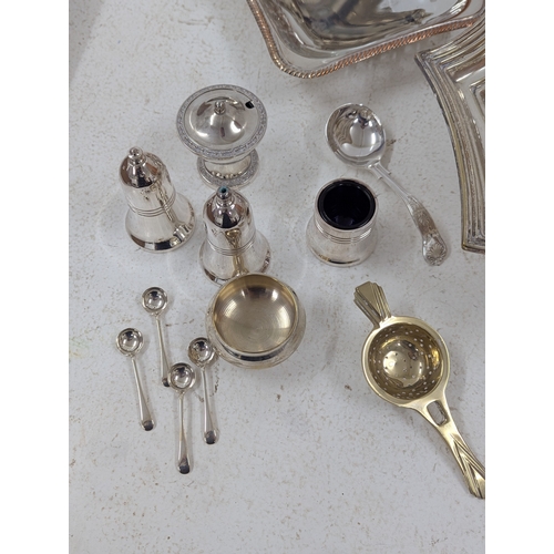 11 - A mixed group of silver plated items to include a pedestal basket with swing handle, goblets and oth... 
