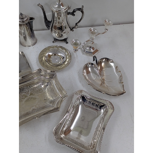 11 - A mixed group of silver plated items to include a pedestal basket with swing handle, goblets and oth... 