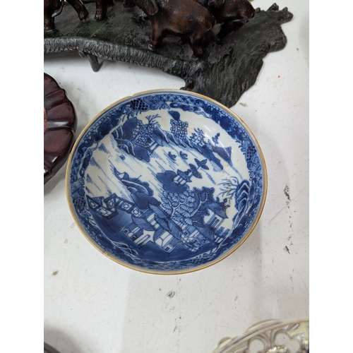 15 - A mixed lot to include a 19th century Chinese blue and white dish, an Oriental soapstone figure, a p... 