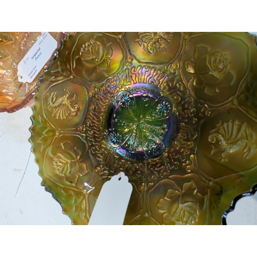 42 - A collection of carnival glass to include a Fenton Dragon and Lotus bowl, Fenton Diamond and Rib vas... 