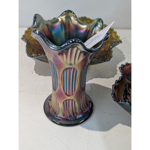 42 - A collection of carnival glass to include a Fenton Dragon and Lotus bowl, Fenton Diamond and Rib vas... 