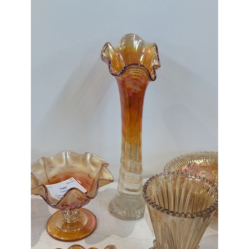42 - A collection of carnival glass to include a Fenton Dragon and Lotus bowl, Fenton Diamond and Rib vas... 