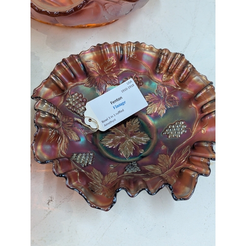 42 - A collection of carnival glass to include a Fenton Dragon and Lotus bowl, Fenton Diamond and Rib vas... 
