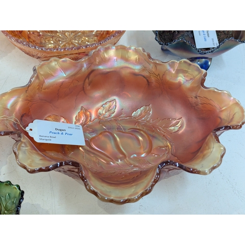 42 - A collection of carnival glass to include a Fenton Dragon and Lotus bowl, Fenton Diamond and Rib vas... 
