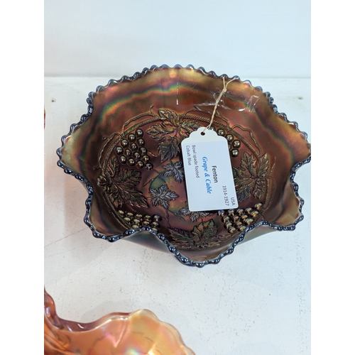 42 - A collection of carnival glass to include a Fenton Dragon and Lotus bowl, Fenton Diamond and Rib vas... 