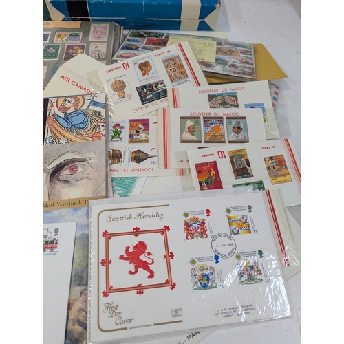 46 - Postage stamps from around the world to include four albums and loose examples from UK, China, India... 