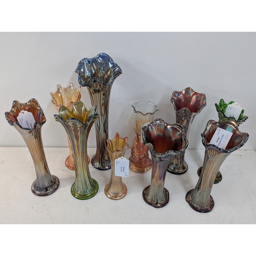 50 - A small group of carnival glass vases to include examples by Fenton, a fish vase by Jain and others ... 