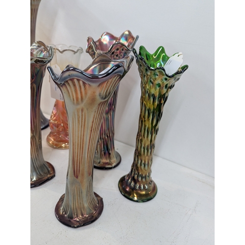 50 - A small group of carnival glass vases to include examples by Fenton, a fish vase by Jain and others ... 