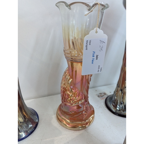 50 - A small group of carnival glass vases to include examples by Fenton, a fish vase by Jain and others ... 