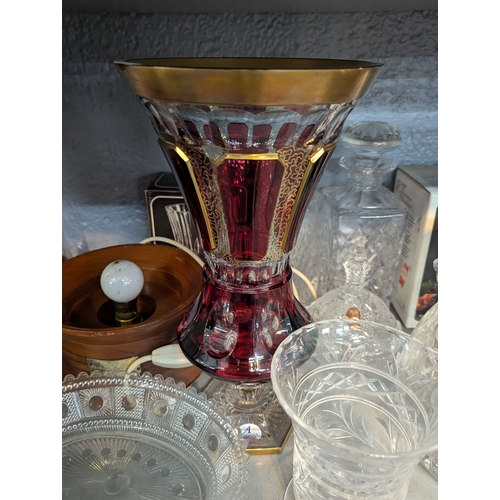51 - A mixed lot to include a Arnstadt Kristall, Antike rubin vase, a cut glass pitcher with silver plate... 