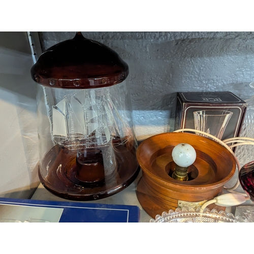 51 - A mixed lot to include a Arnstadt Kristall, Antike rubin vase, a cut glass pitcher with silver plate... 