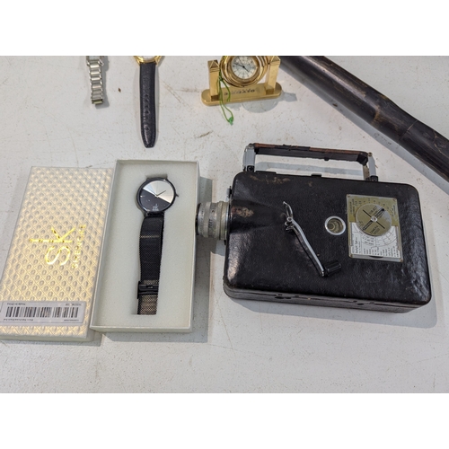 57 - A mixed lot to include a 19th century rosewood tea caddy, a vintage 1930-40's 16mm Cine-Kodak, wrist... 