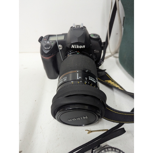 58 - A collection of Nikon cameras and accessories, comprising a Nikon D70 digital SLR camera fitted with... 
